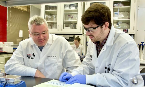 Afonin with a graduate student in his lab.