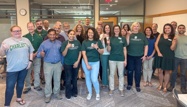 A smiling group of faculty and staff from the Klein College of Science celebrate Klein College Day on Sept. 24, 2025.