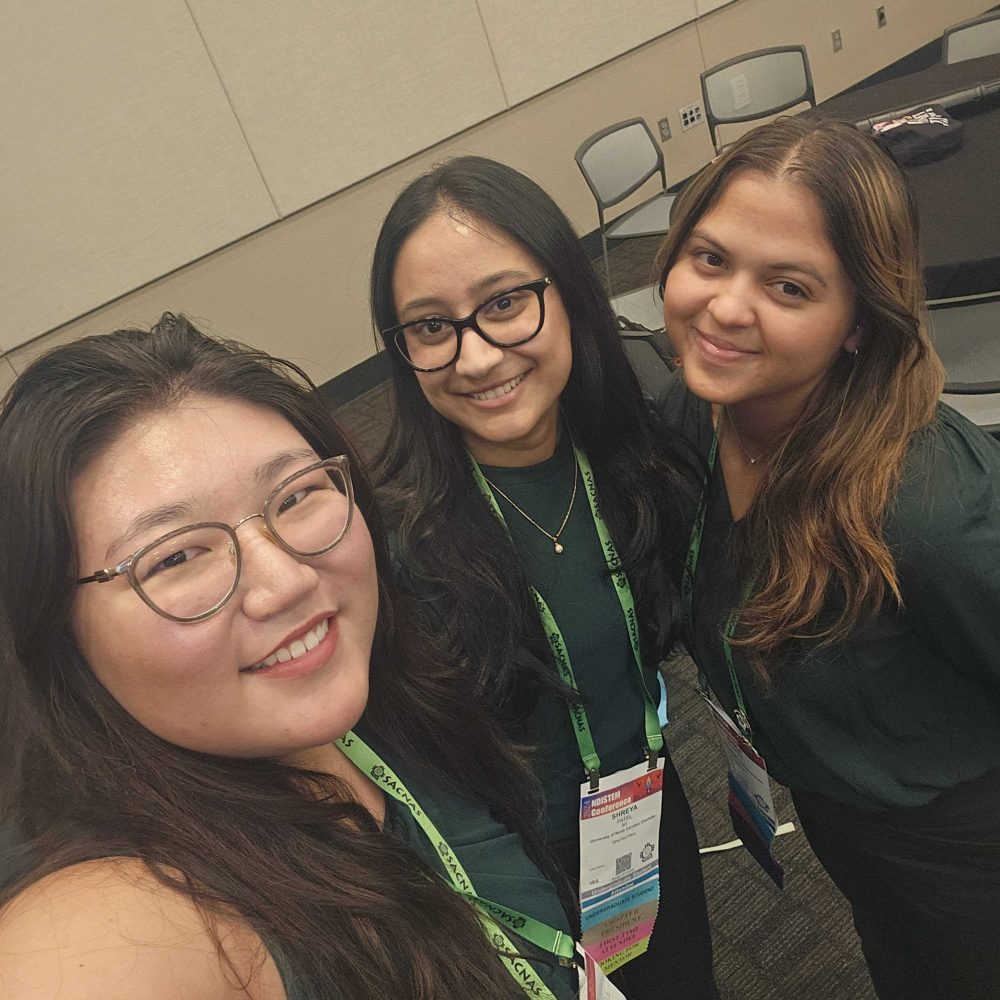 Ashley Choi, Shreya Patel, and Erica Flores taking a selfie at the SACNAS conference.
