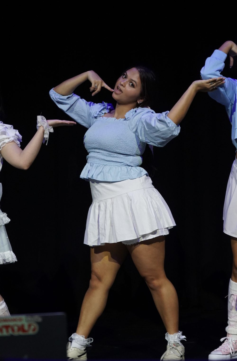 Erica Flores on stage for the Fine9 performance of Jellyous