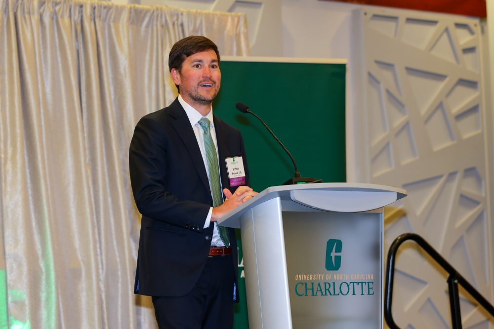 Jeffrey Powell speaks at the UNC Charlotte podium.