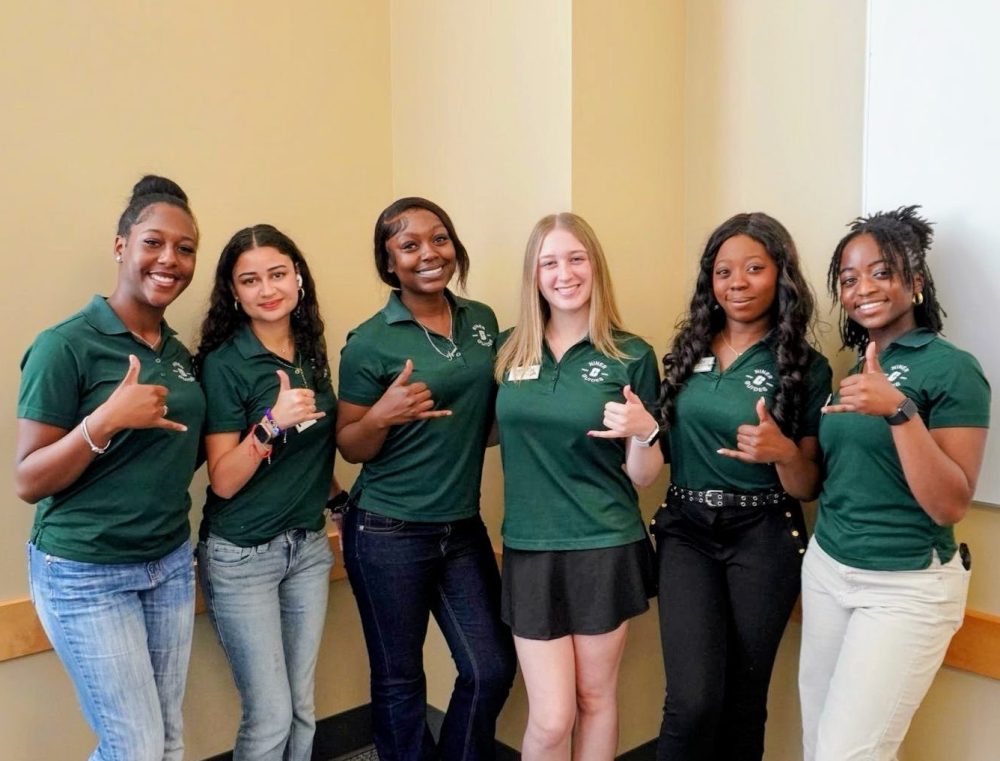 Ntasin poses with other students on Admitted Students Day.
