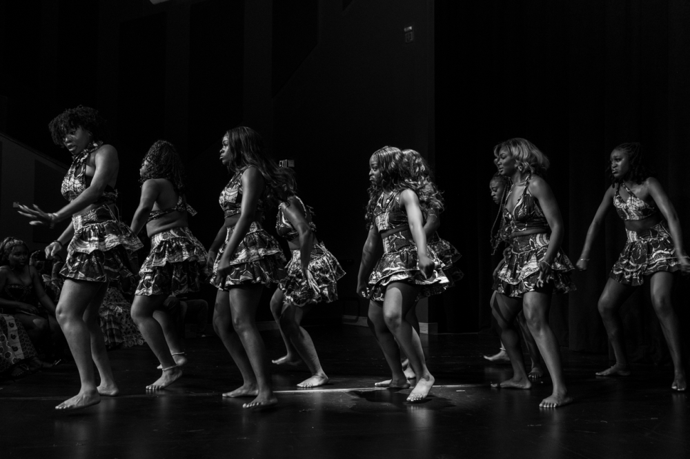 Black and white photo of African Night dance performance.
