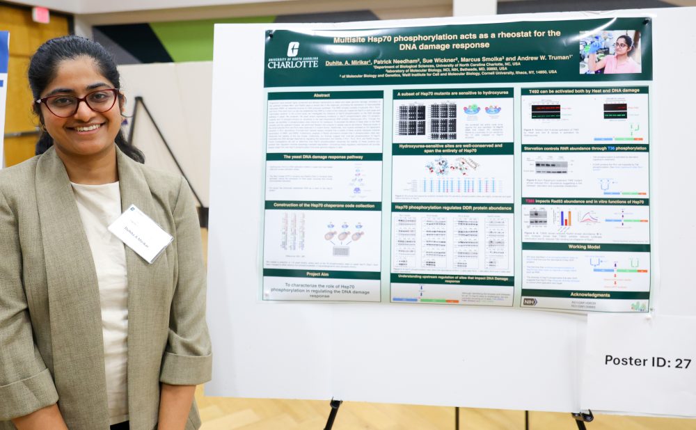 Mirikar poses in front of her poster.