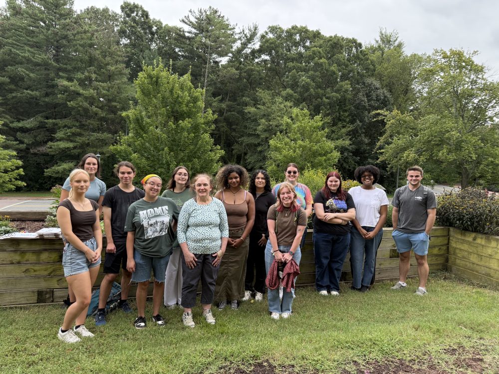 Zarah Rahman Blythe and Carrie Wells, Ph.D., pose for a group photo with students in front of the Pollinator Garden by McEniry during the Great Southeastern Pollinator Census on Aug. 22, 2025.